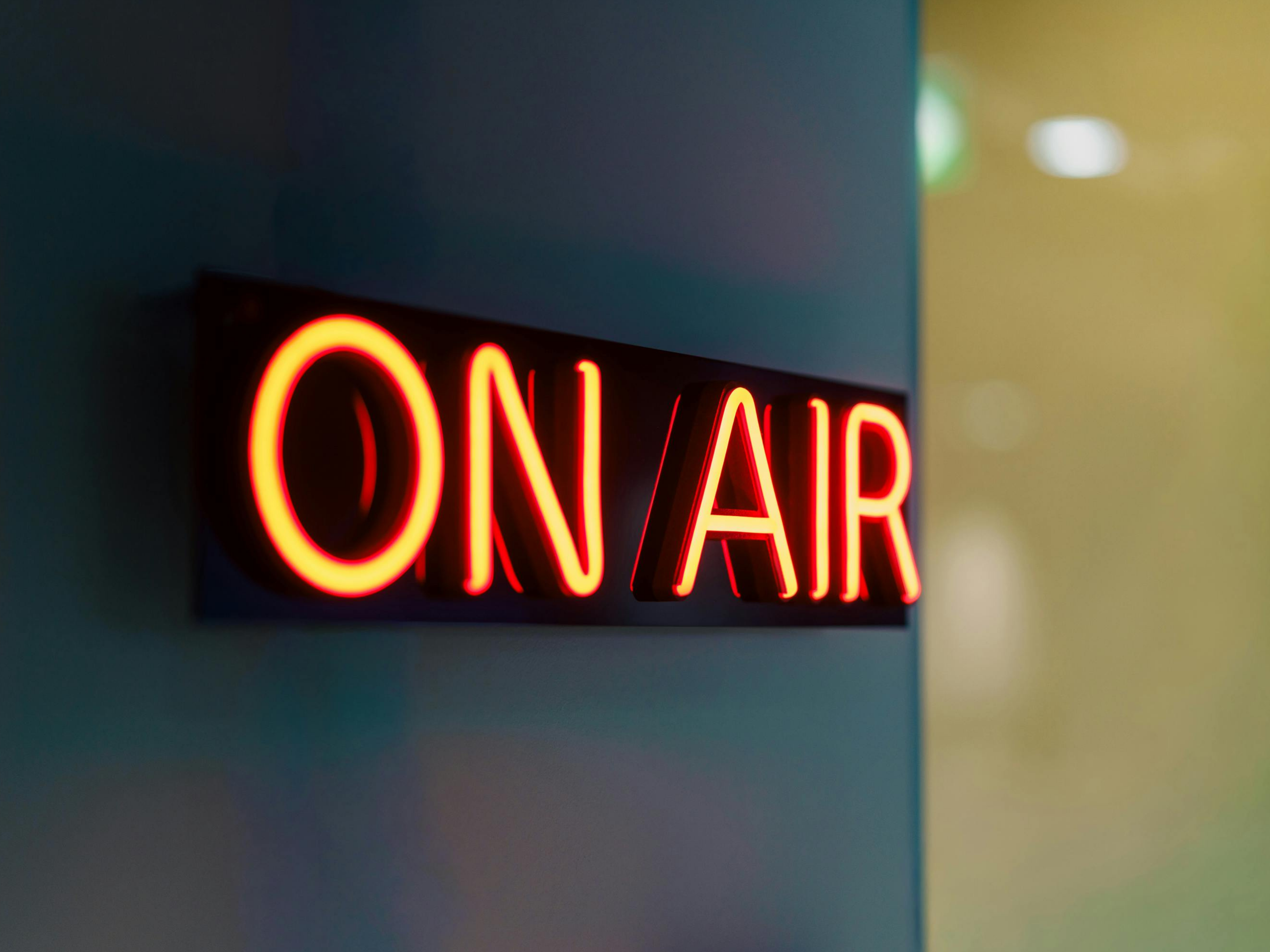 Neon-style ON AIR sign in a broadcast studio
